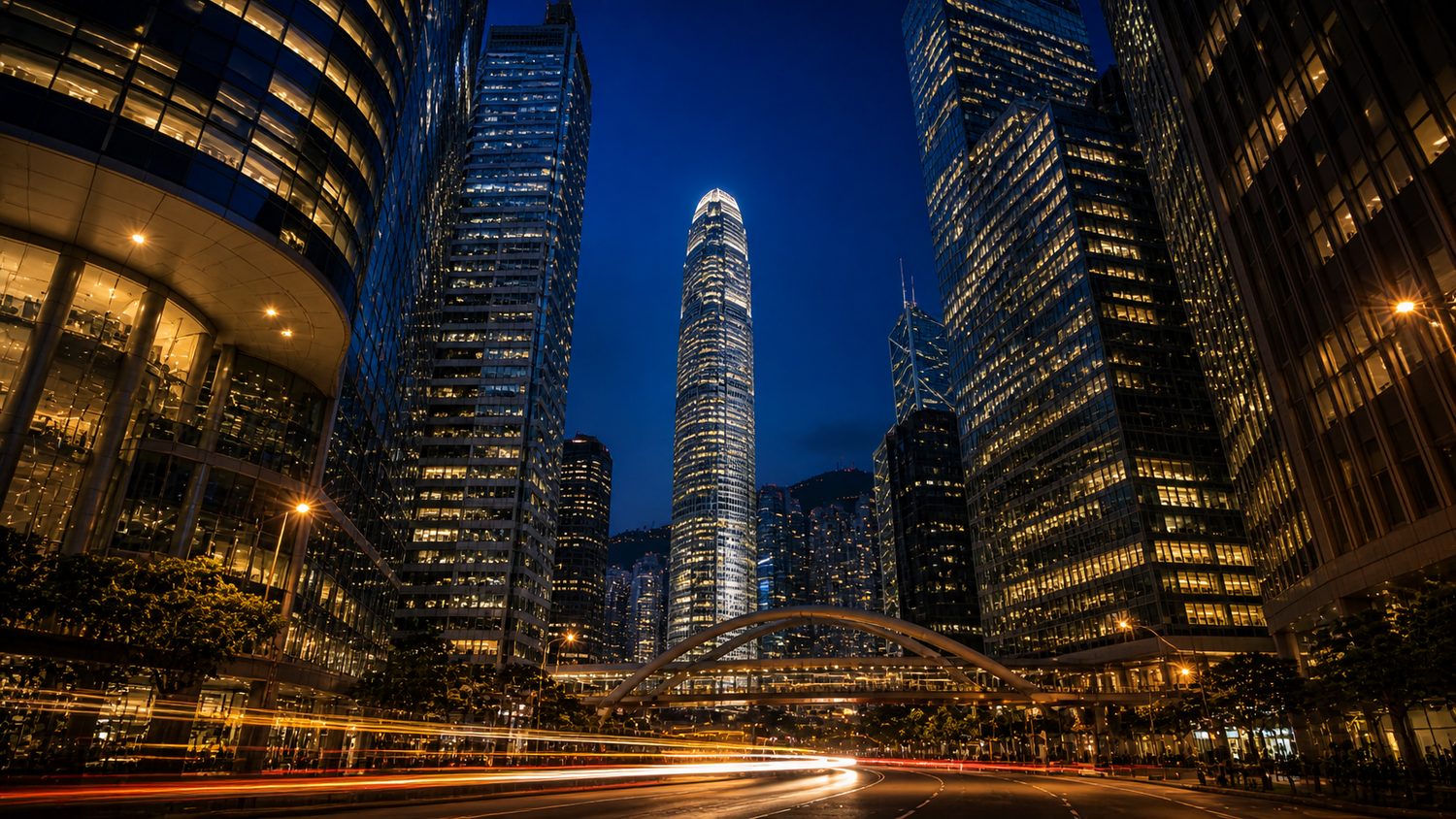 Hong Kong Central skyline at night with IFC and light trails
